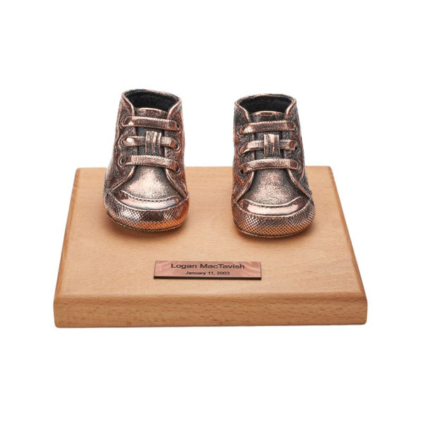 Mount your pair of baby shoes onto a base with free engraving